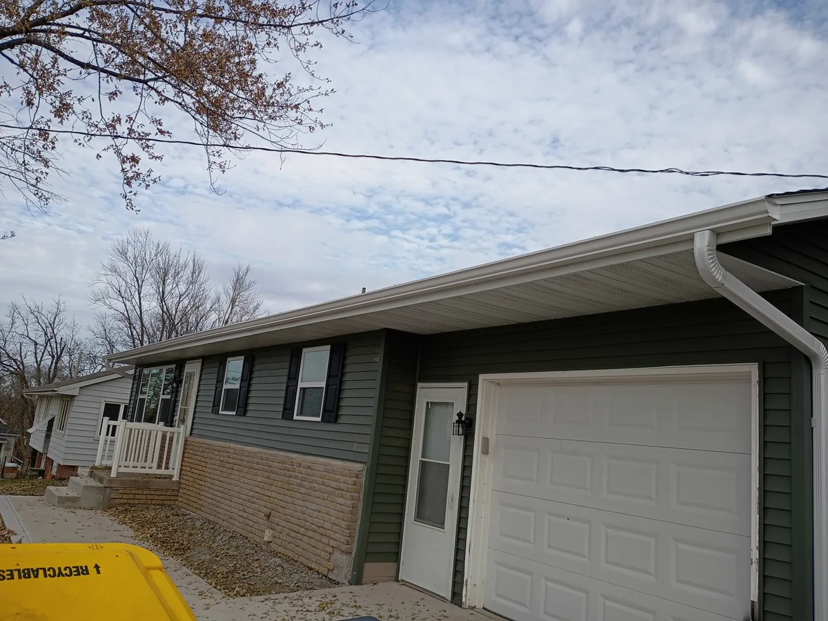Seamless gutter installation on a home in Colfax, Iowa
