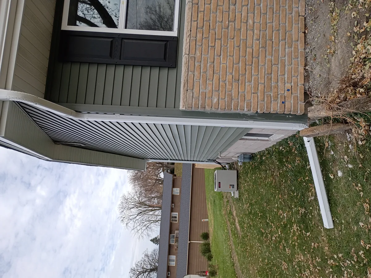 Seamless gutter installation on a home in Colfax, Iowa
