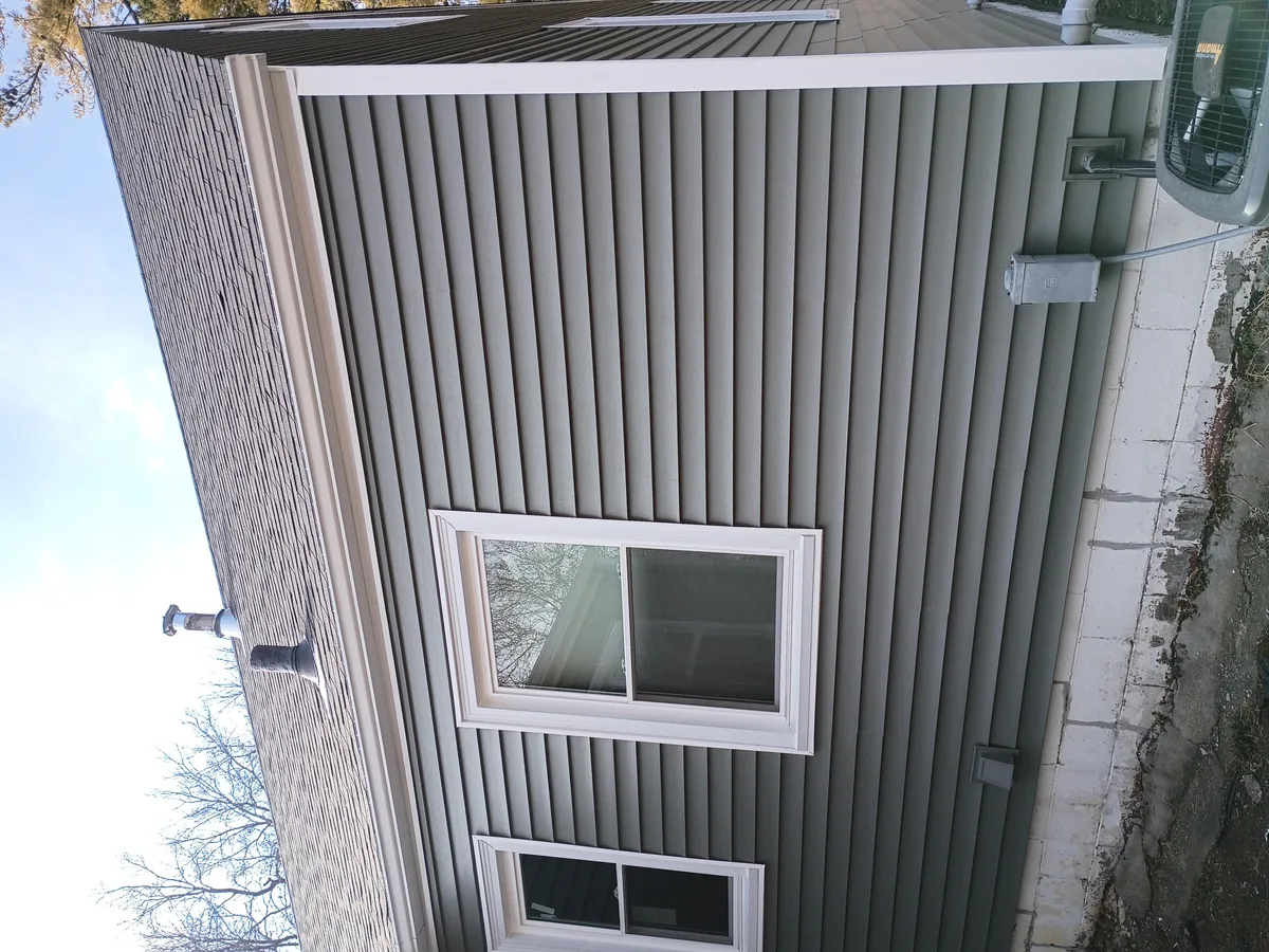 Seamless gutter installation on a home in Des Moines, Iowa